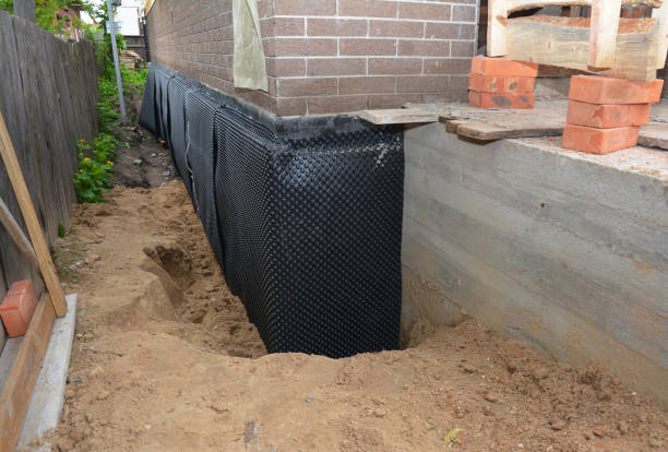Happy homeowners after waterproofing job in Margate City